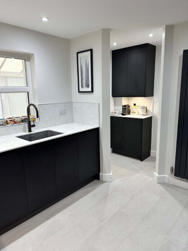 Black Handless Kitchen in Keller Range showing Quooker Tap